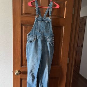 Denim bib overalls with raw hem